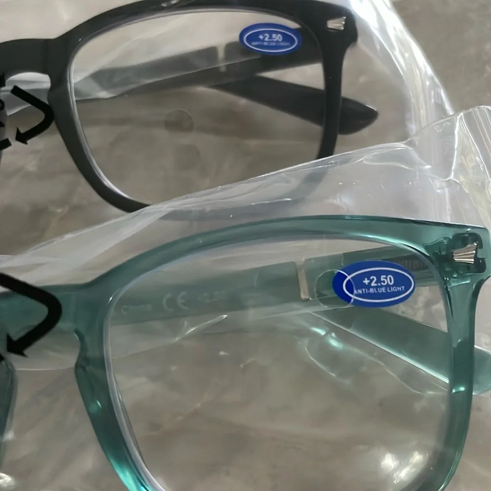 Two pairs readers 2.5 + blue light combination readers one black and one teal